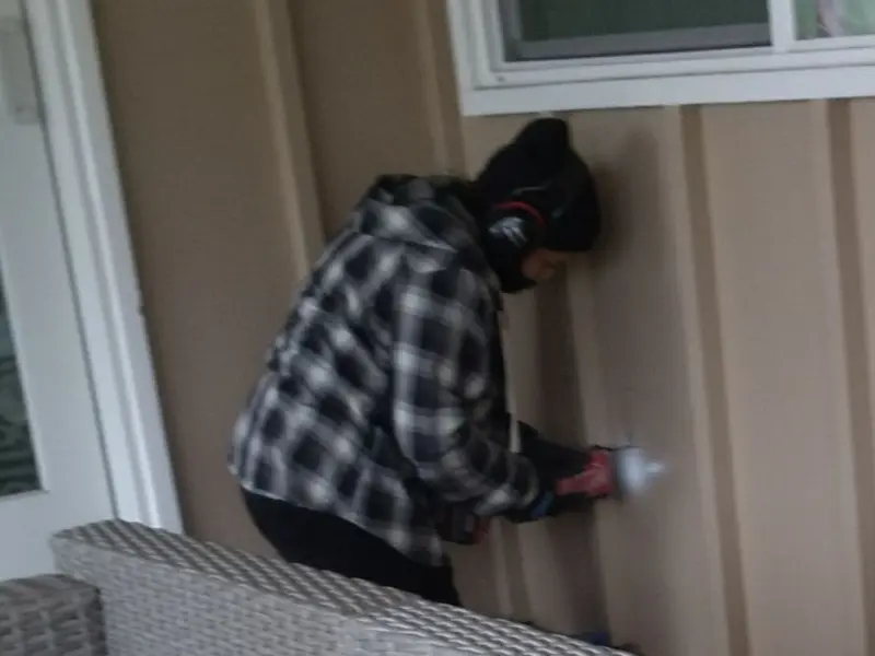 Professional electrician installing an exterior outlet in Chubbuck